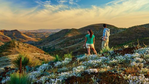 Man and women look across mountain area