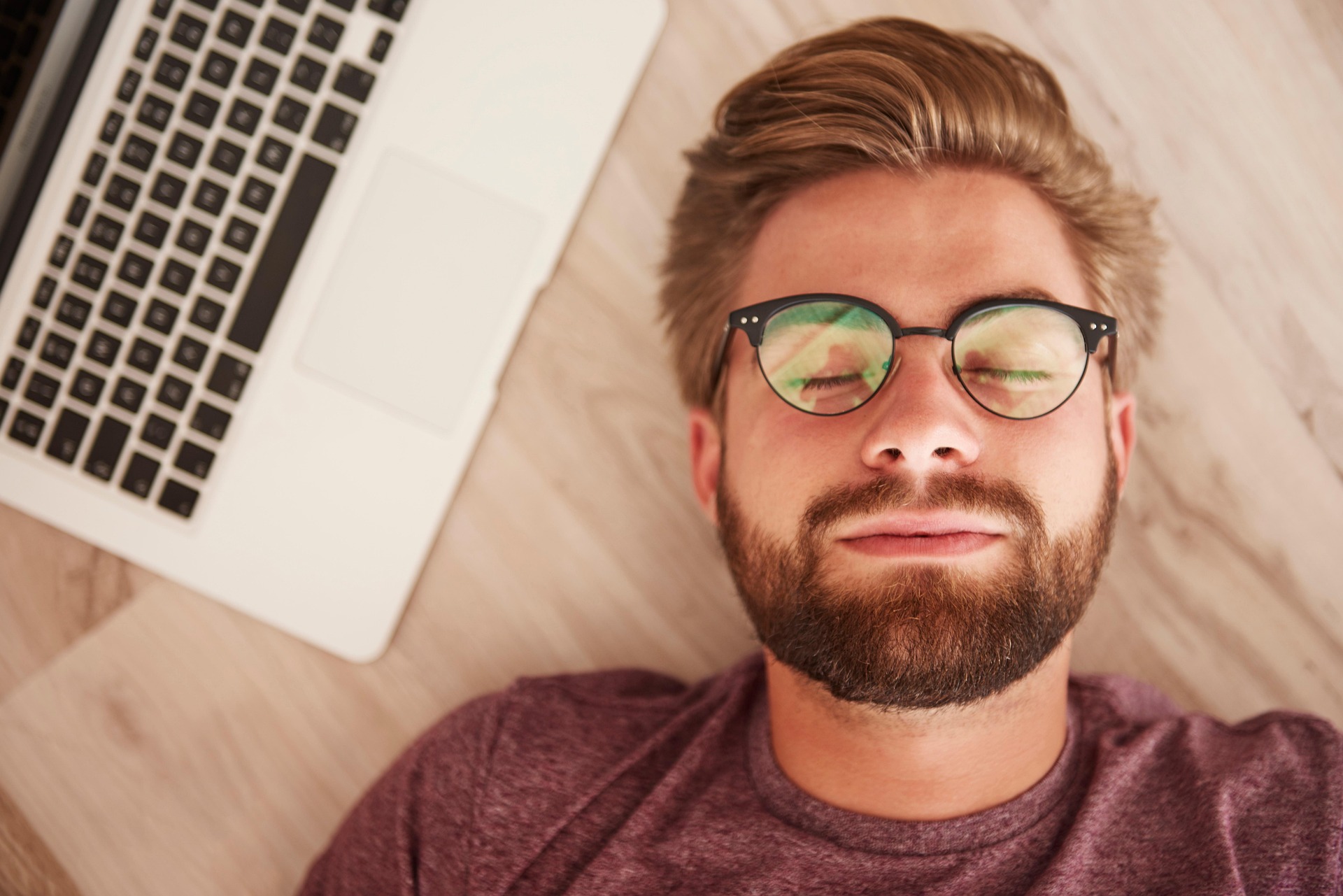Man dreaming by his laptop