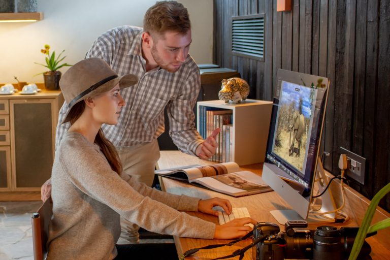 Person working on computer with guidance.