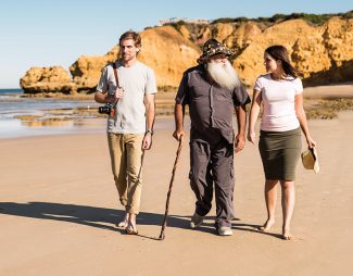 Guided walk on a beach with an Aboriginal man